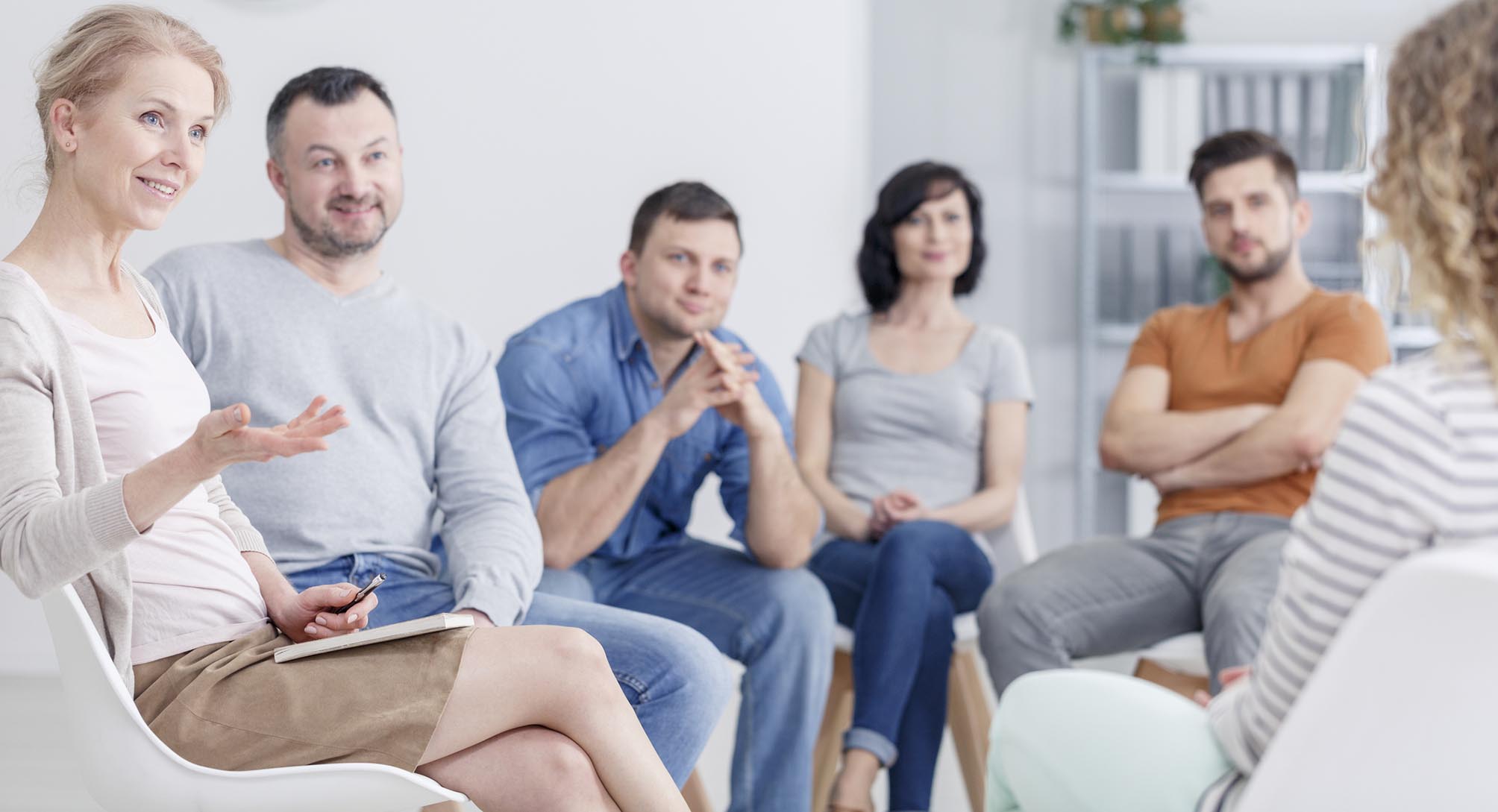 Therapist congratulating woman on progress