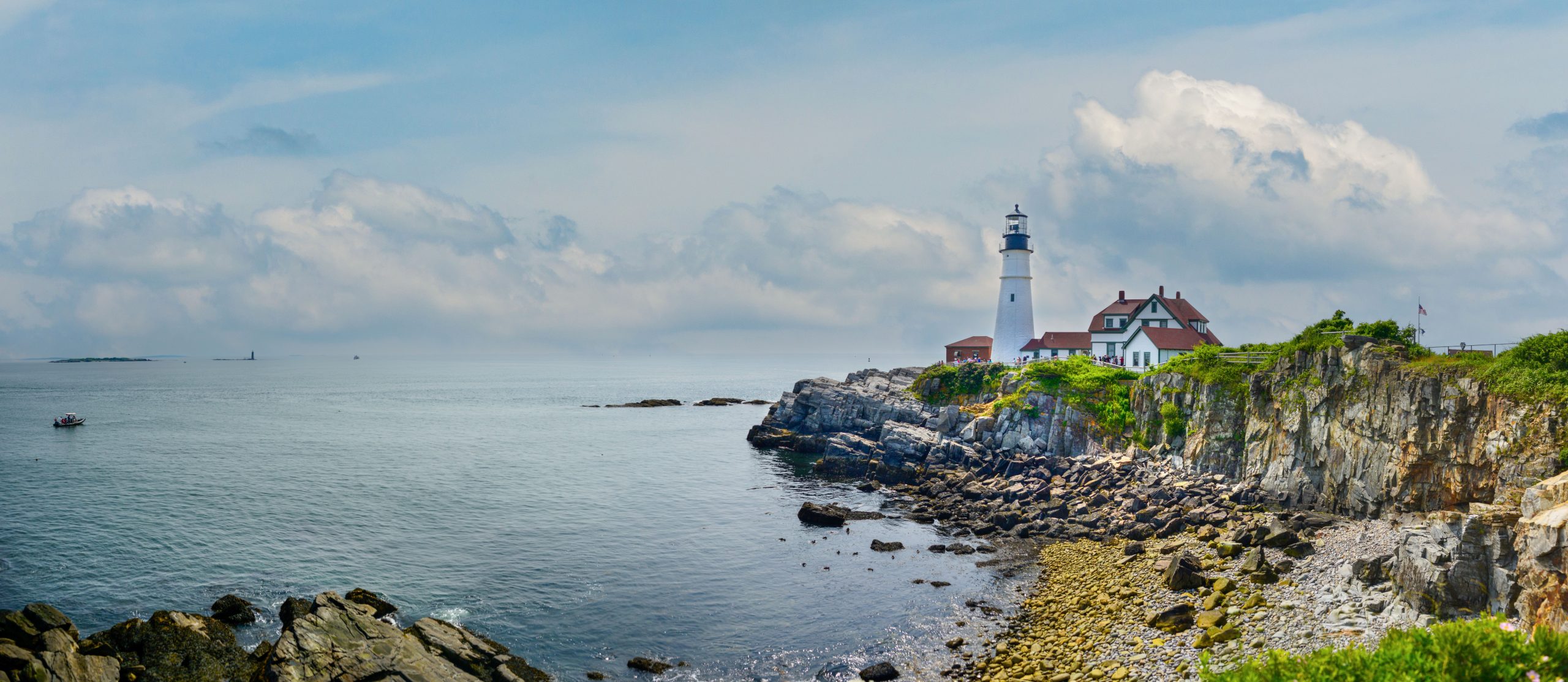 A Maine lighthouse on body of water